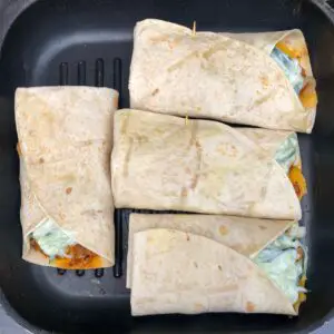 chicken wraps in pan